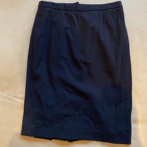 Black stretch wool Armani skirt with pleat details in the back